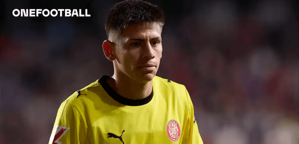Goalkeeper in yellow jersey walking on field