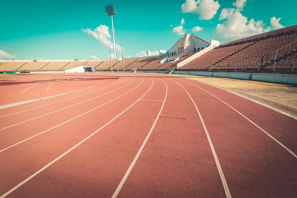 Empty athletic track and seating at stadium