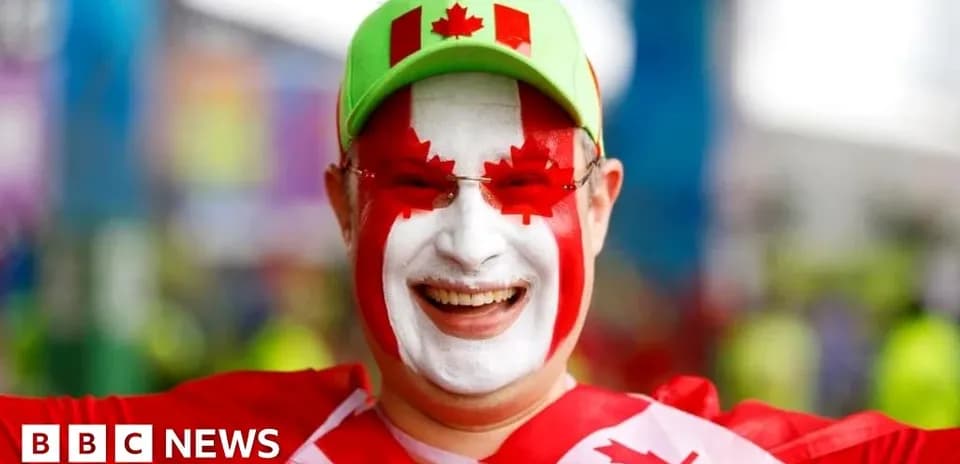 Fan celebrating with Canadian flag face paint