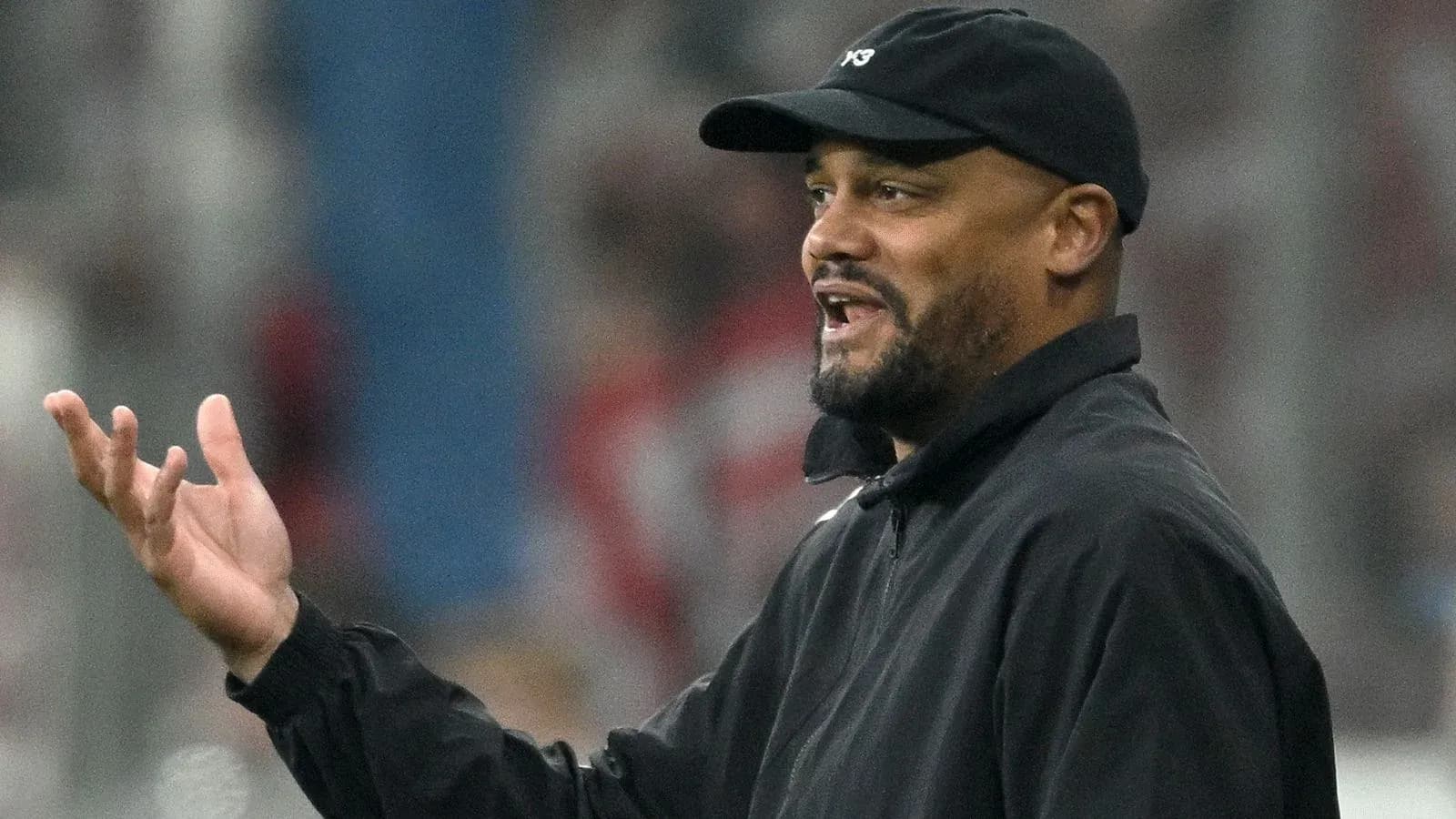 Coach gesturing during a match on the sidelines