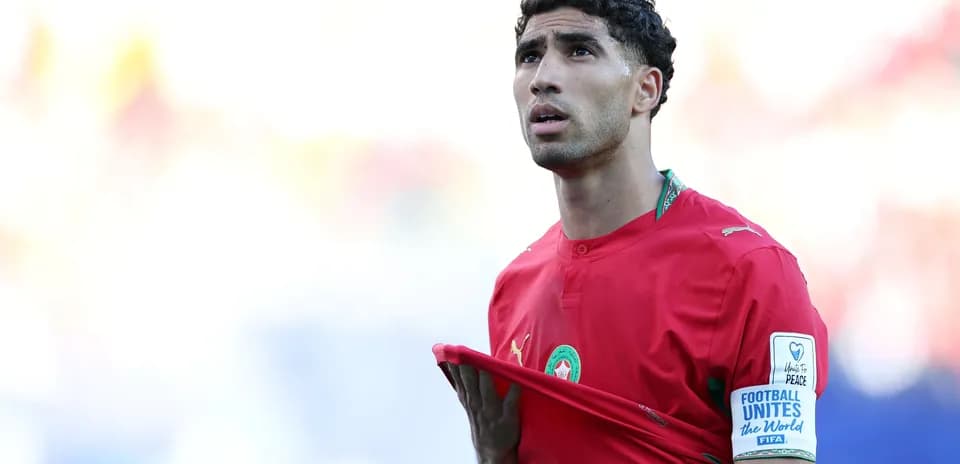 Player in red jersey looking up during match