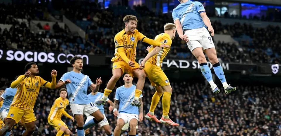 Erling Haaland jumping for a header in match