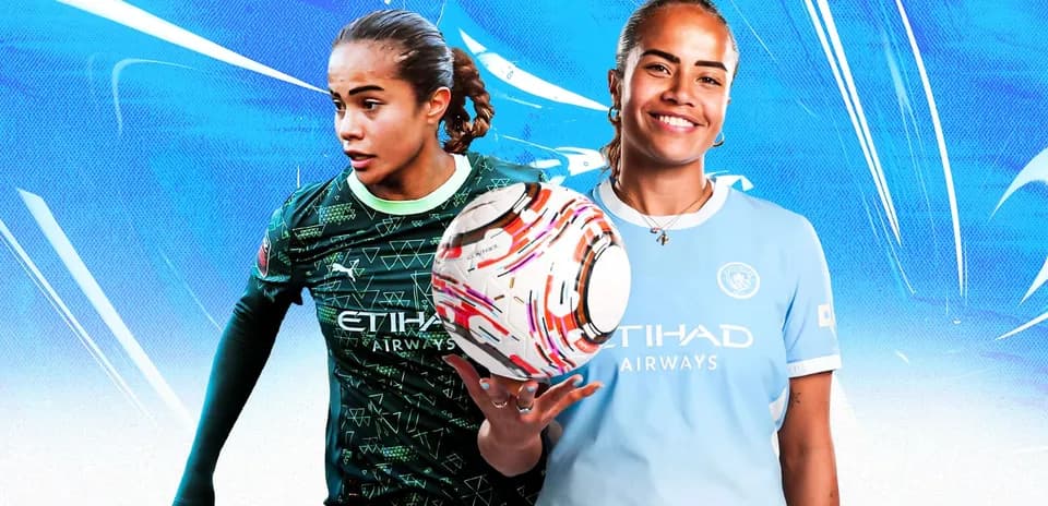 Two female soccer players posing with a ball