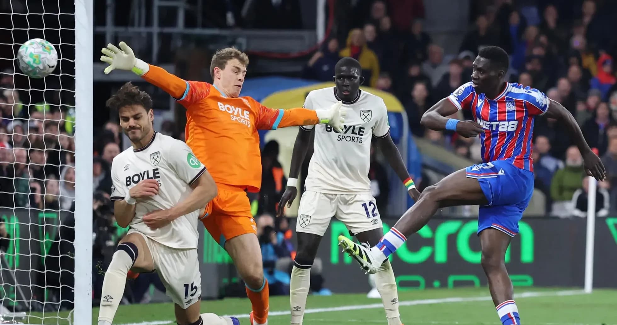 Crystal Palace player shooting at goal against West Ham