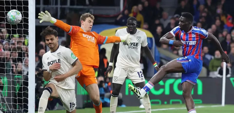 Crystal Palace player shooting at goal against West Ham