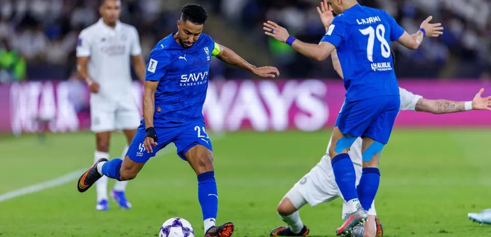 Player dribbling the ball during a football match