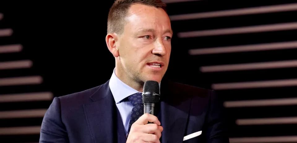 Man speaking into microphone at event