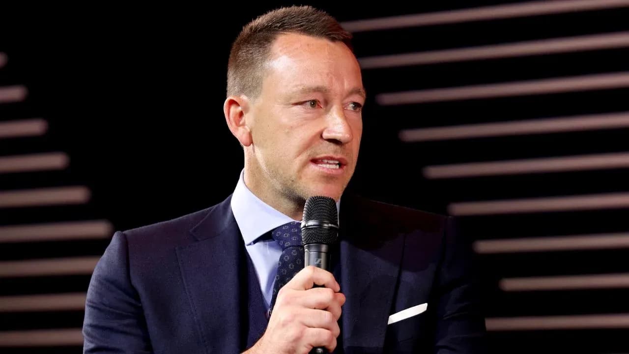 Man speaking into microphone at event