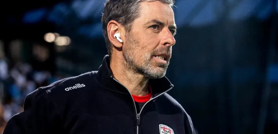 Coach wearing earbuds during match preparation