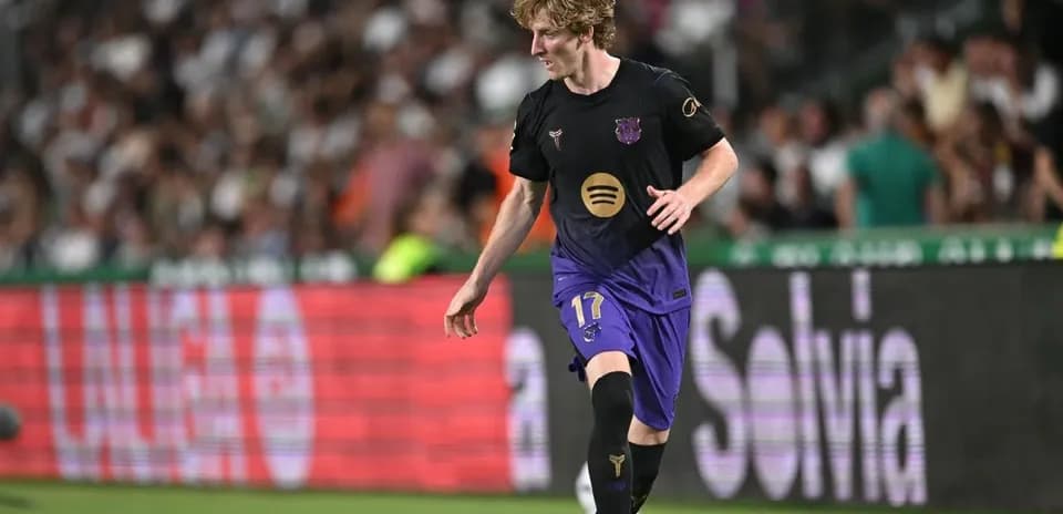 Player in Barcelona kit dribbling the ball during match