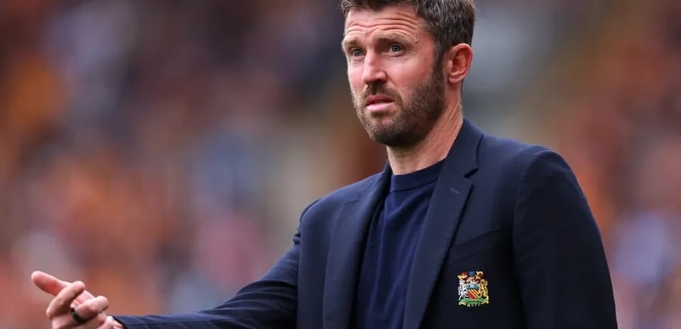 Manager gesturing during a football match