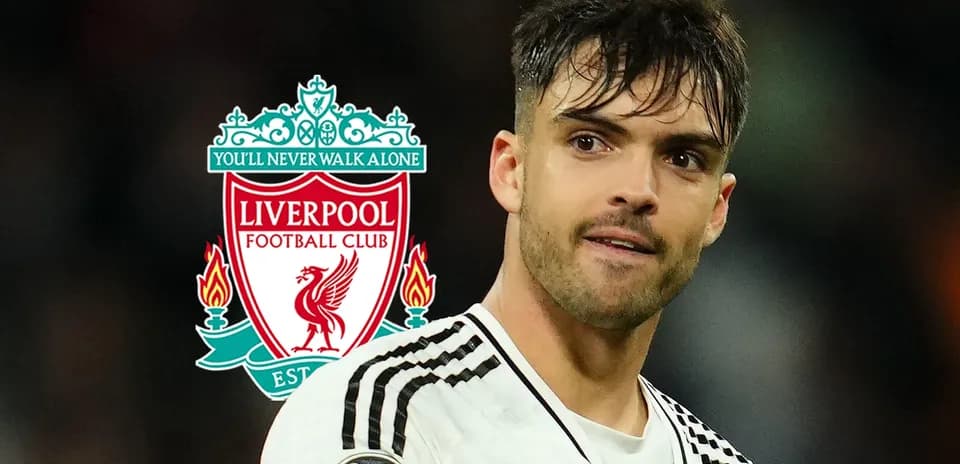 Player in front of Liverpool FC logo