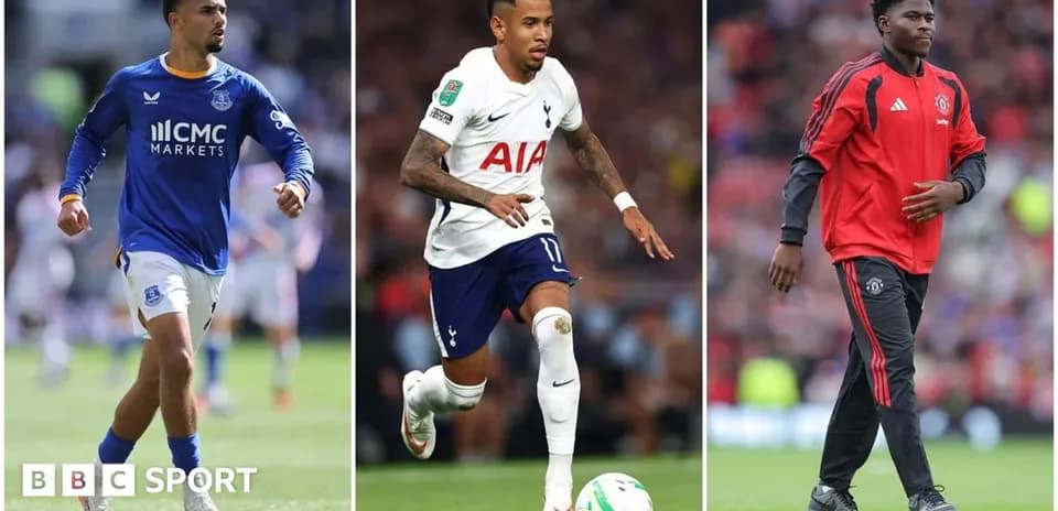 Three football players from different teams on pitch