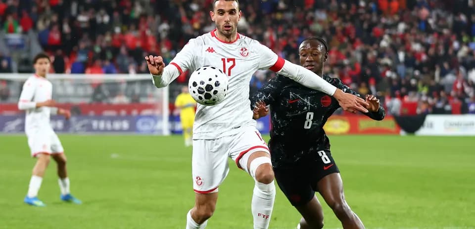 Two players contesting the ball during a match