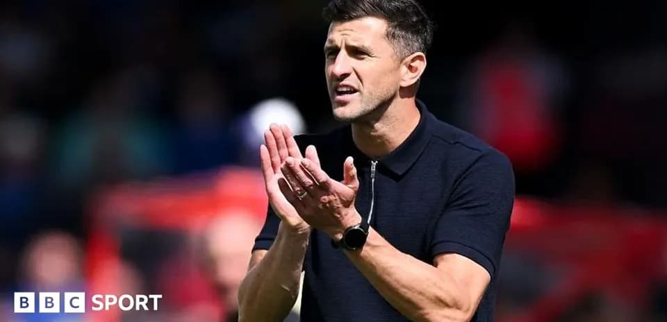Manager clapping and giving instructions on the sidelines