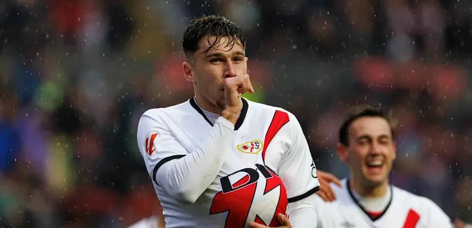Player celebrating with finger to lips after scoring