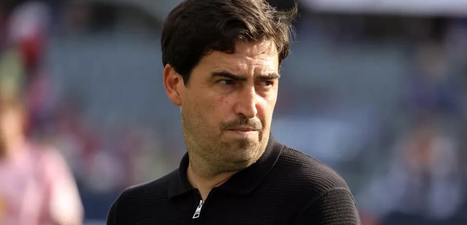 Coach observing the match from the sidelines