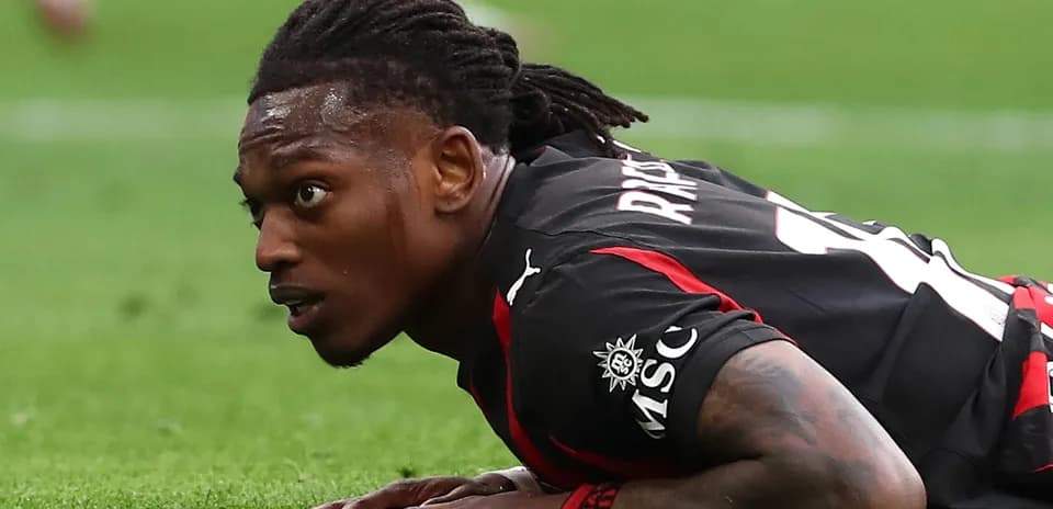 Player lying on pitch during a football match