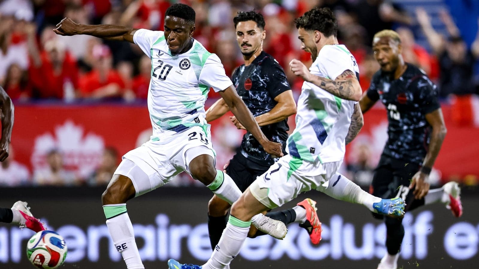 Players competing for the ball during soccer match