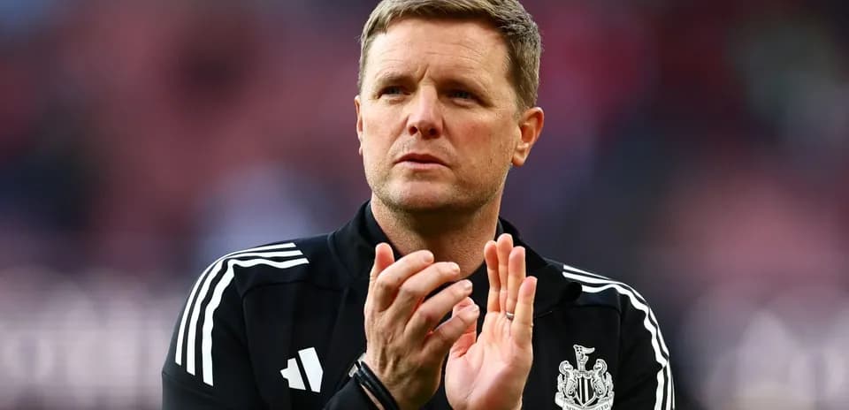 Manager applauding fans before the match