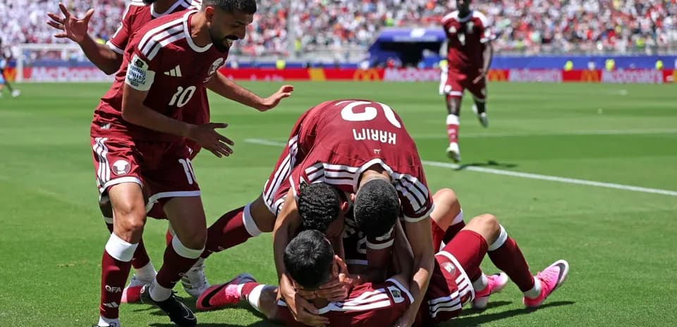 Qatar players celebrating a goal during match
