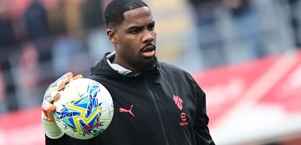 Goalkeeper holding ball before match warm-up