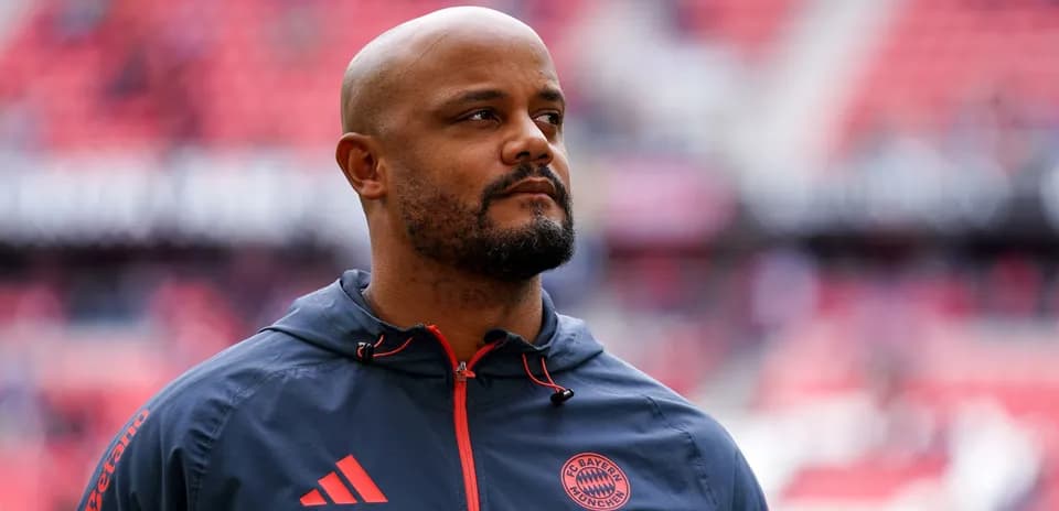 Bayern Munich staff member on the pitch before match