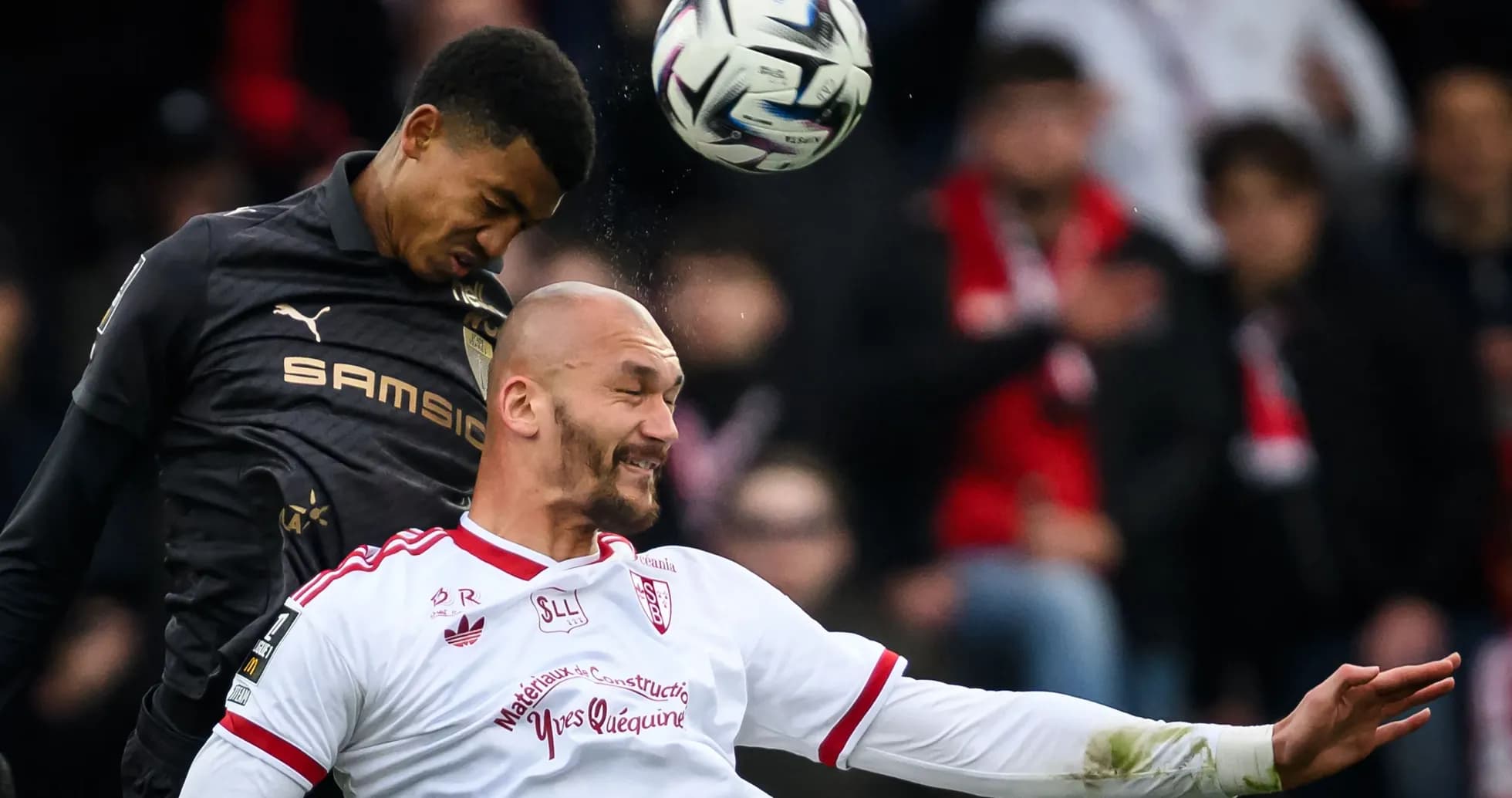 Players contesting a header during a match
