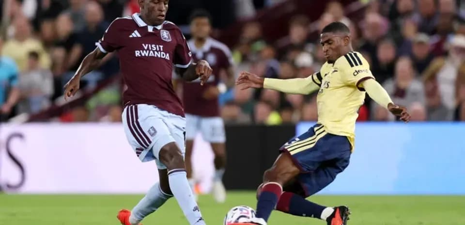 Two players competing for the ball on the field