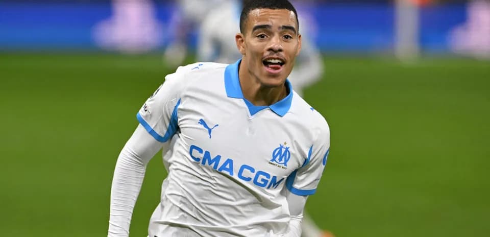 Player celebrating goal in Marseille's white kit
