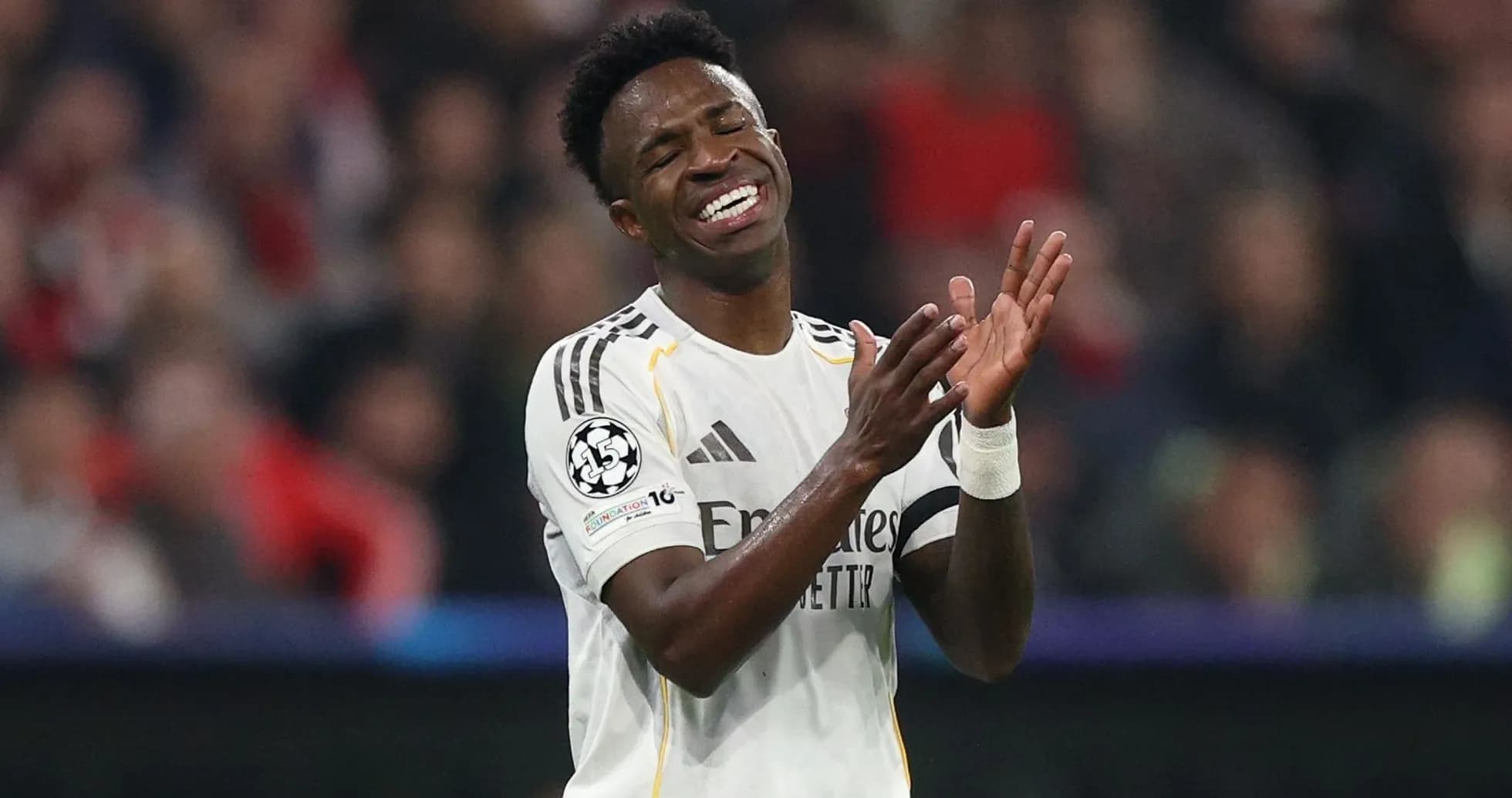 Player applauding during a Champions League match
