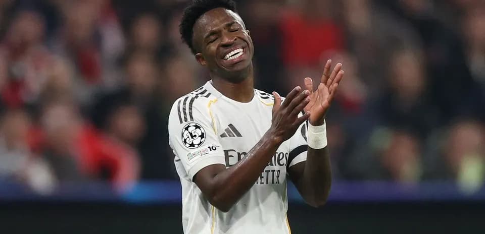 Player applauding during a Champions League match