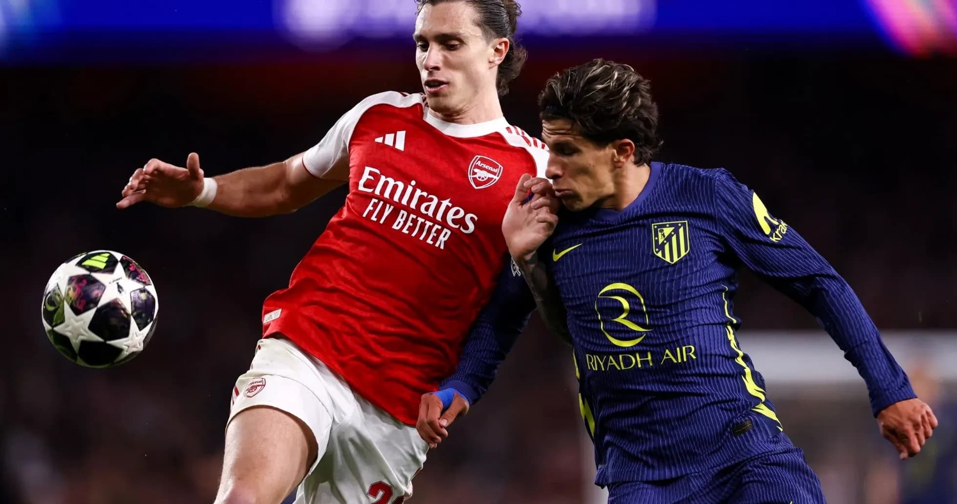 Two players contesting the ball during match