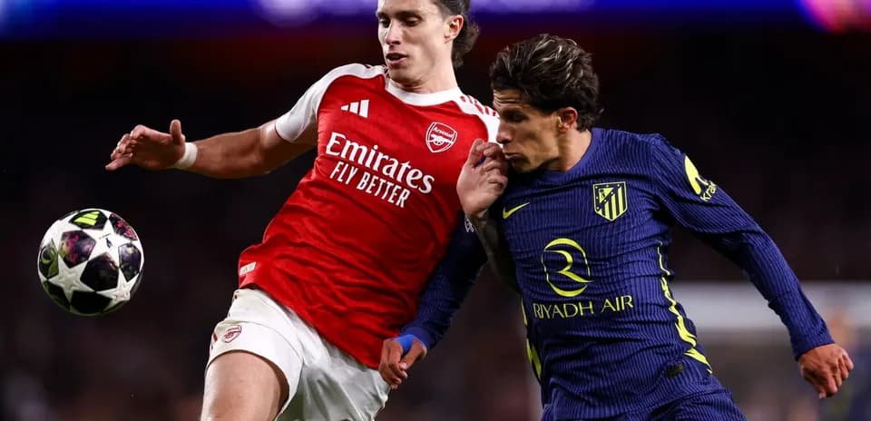 Two players contesting the ball during match