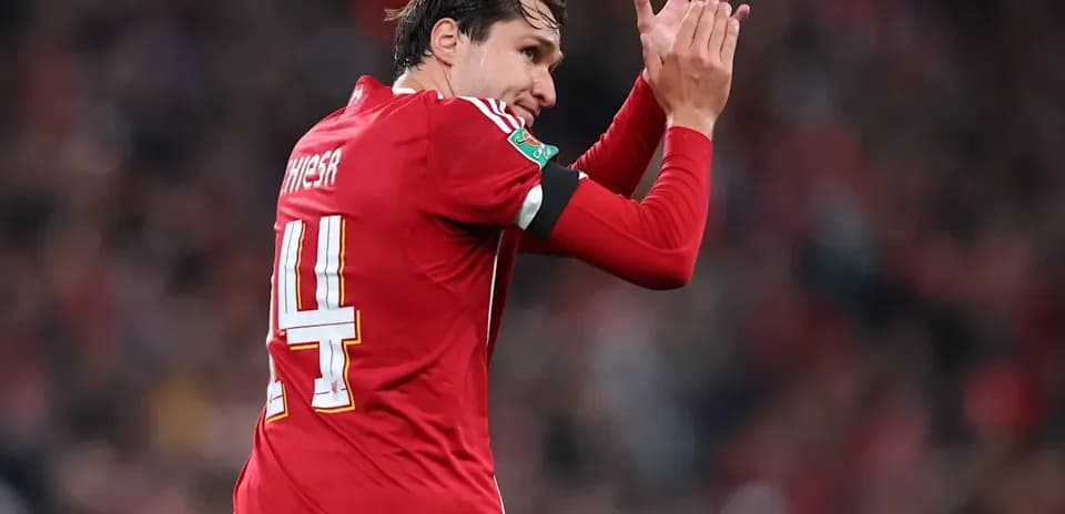Player applauding fans during a match