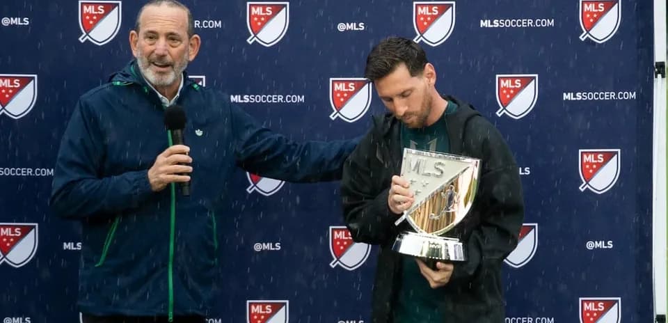 Speaker presenting trophy to player during ceremony