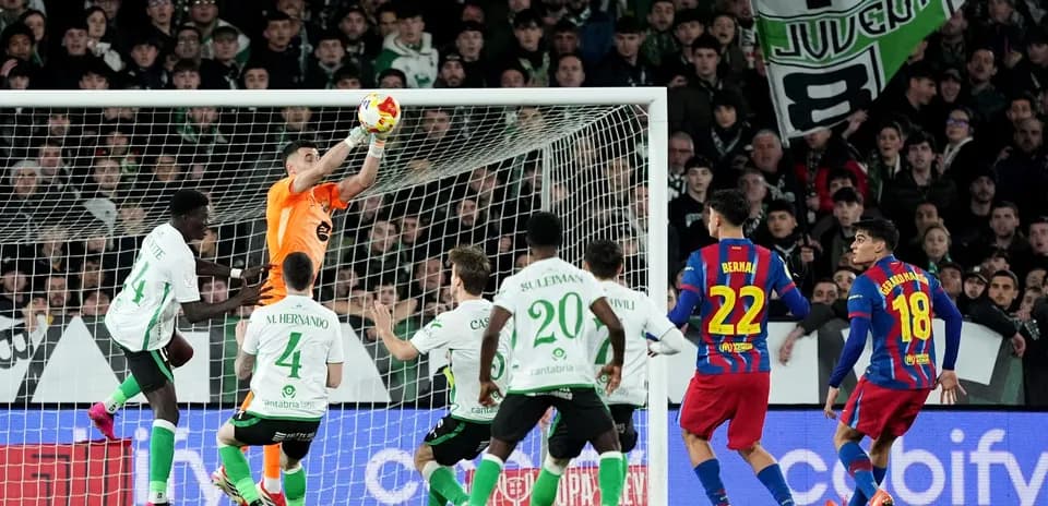 Goalkeeper catching the ball during match action
