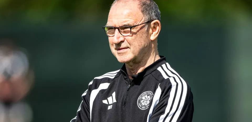 Coach observing training session at football facility