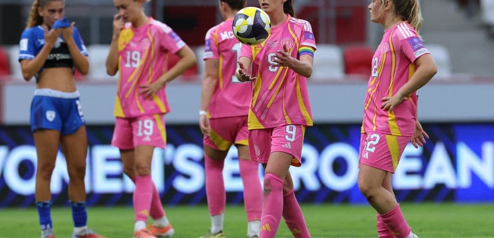 Players in pink kits during a match moment