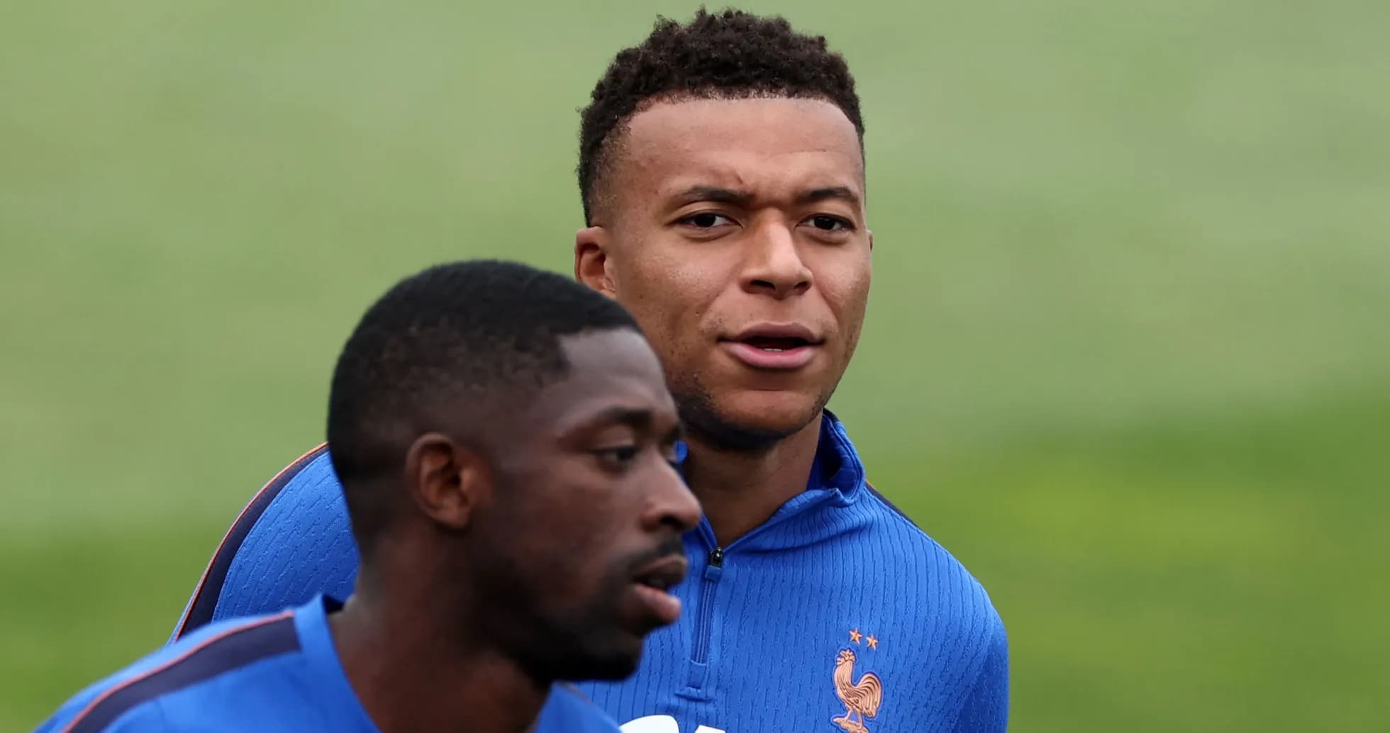 Two players training in blue jerseys during session
