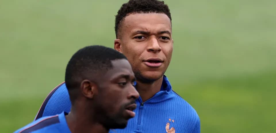 Two players training in blue jerseys during session