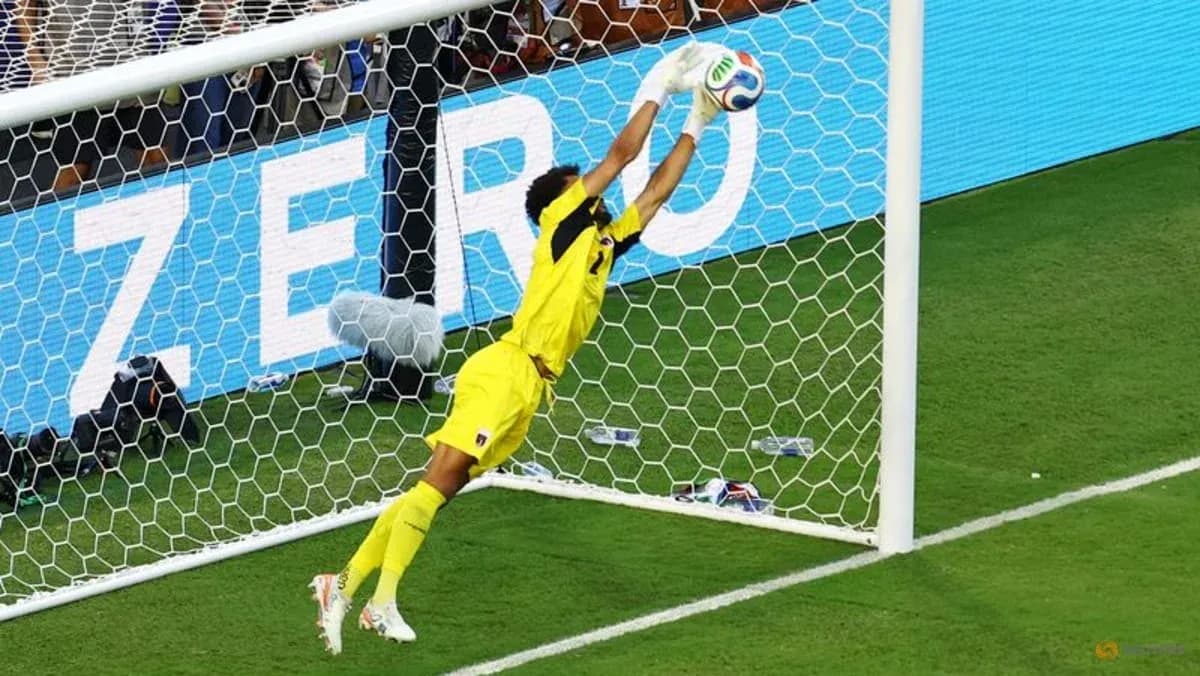 Goalkeeper making a save during a match