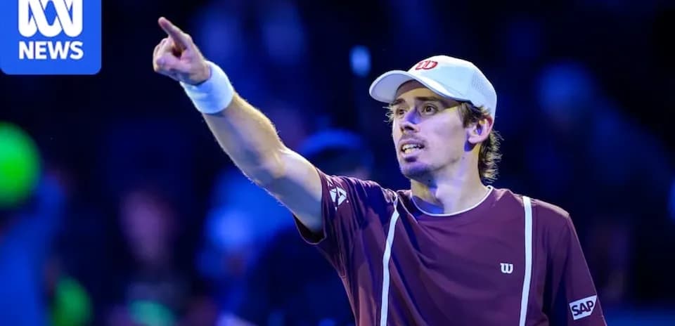 Tennis player celebrating and pointing during match