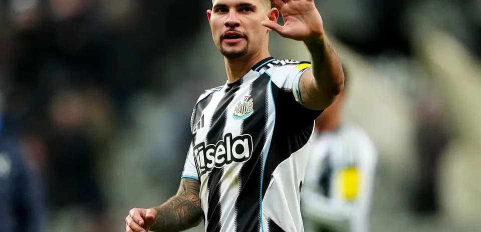 Newcastle player waving to the crowd during match