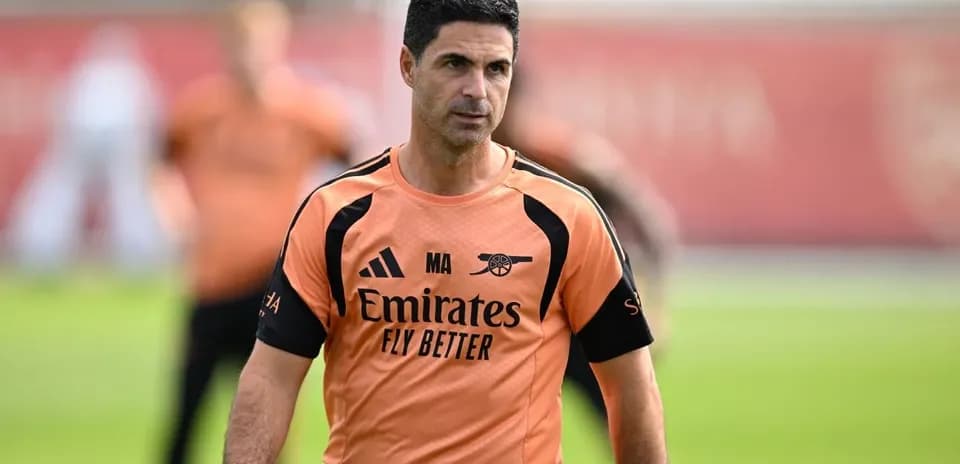 Arsenal manager during training session on pitch