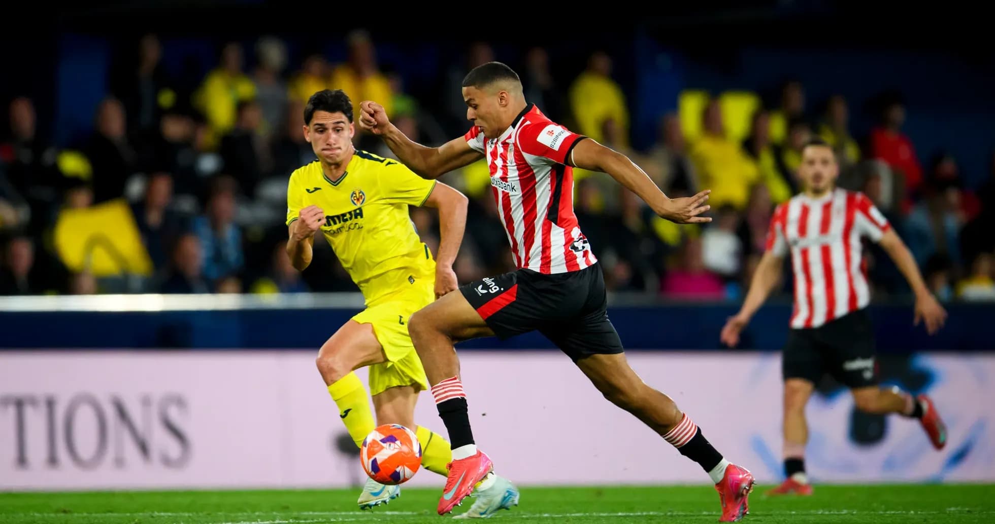 Athletic Club player dribbling past Villarreal opponent