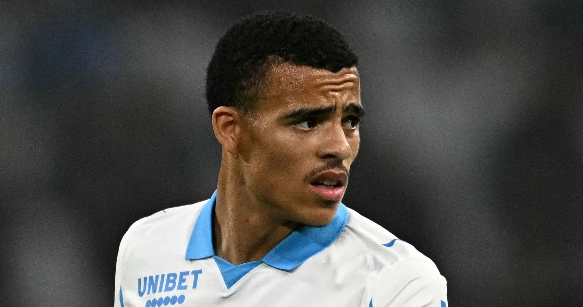 Player wearing Marseille jersey during match