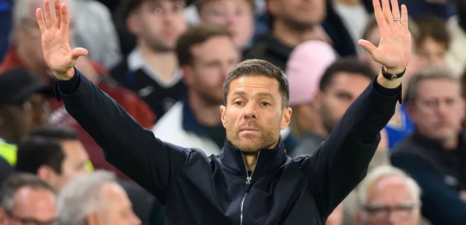 Coach gesturing from the sidelines during match