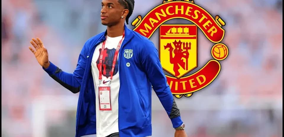 Player walking with Manchester United logo in background