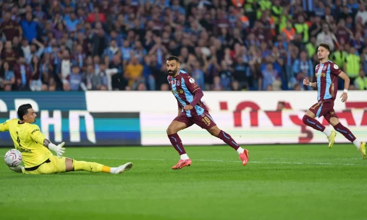 Player scoring a goal against the goalkeeper